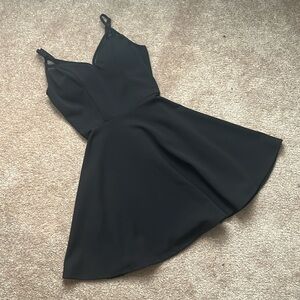Beautiful never worn black party dress, size 1-2. No tags.